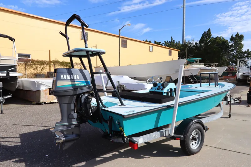Slide: The Image of 1996 Silver King Signature 16 boat with Yamaha outboard motor on a trailer. - 4