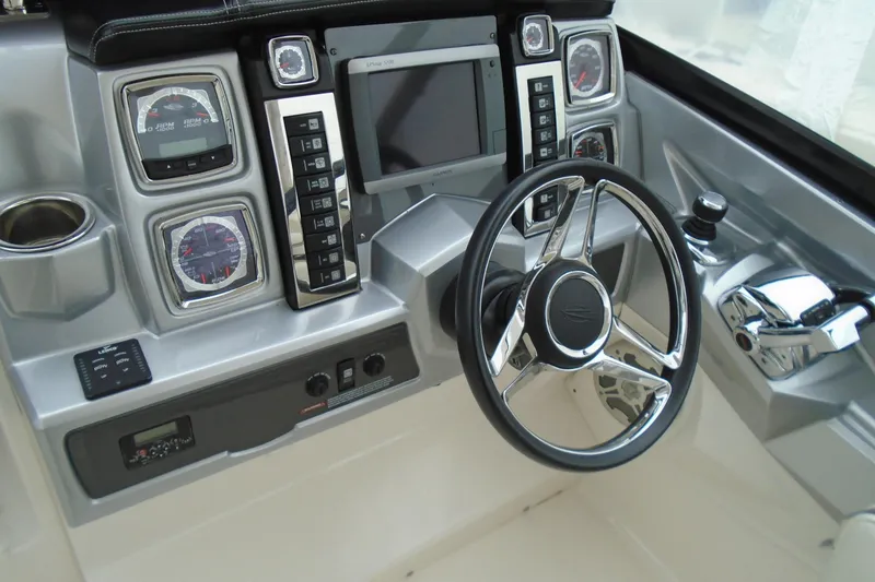 Slide: The Image of 2013 Chaparral 327 SSX boat seat with red and gray accents, quilted design. - 12