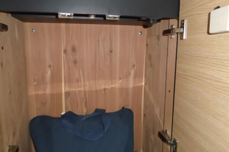 Slide: The Image of Interior of 2013 Chaparral 327 SSX boat with white leather seating and porthole windows. - 20