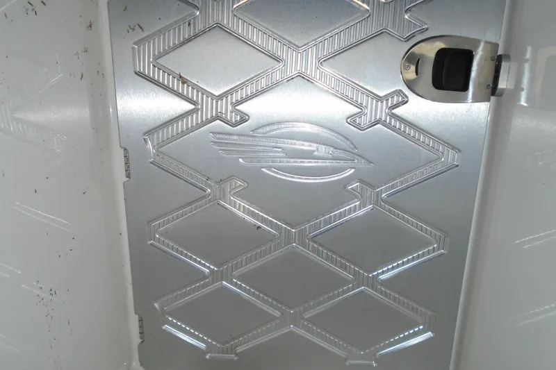 Slide: The Image of Interior seating area of 2013 Chaparral 327 SSX boat, featuring white upholstery. - 26