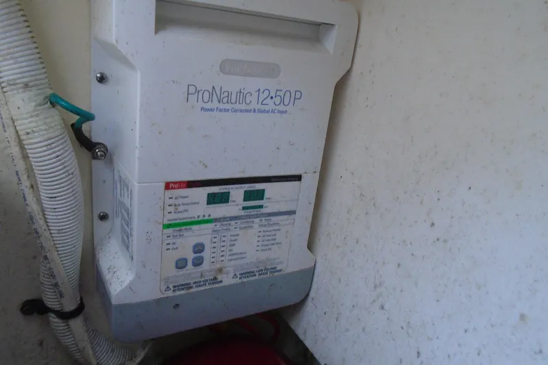 Slide: The Image of Storage compartment of 2013 Chaparral 327 SSX with red fenders and bag. - 29