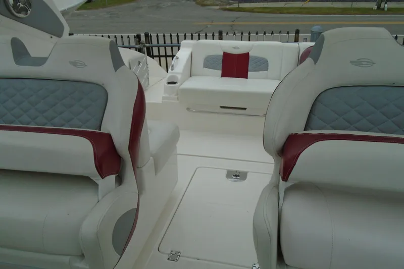 Slide: The Image of Interior of 2013 Chaparral 327 SSX boat with white and red seating. - 40