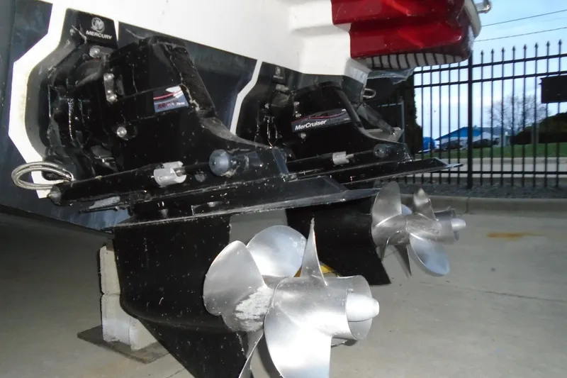 Slide: The Image of 2013 Chaparral 327 SSX boat with red cover and white arch structure. - 6