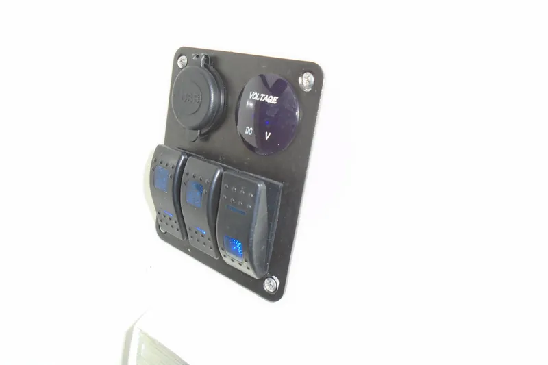 Slide: The Image of Control panel with USB and voltage meter on 2003 Cruisers Yachts 3470 Express. - 18