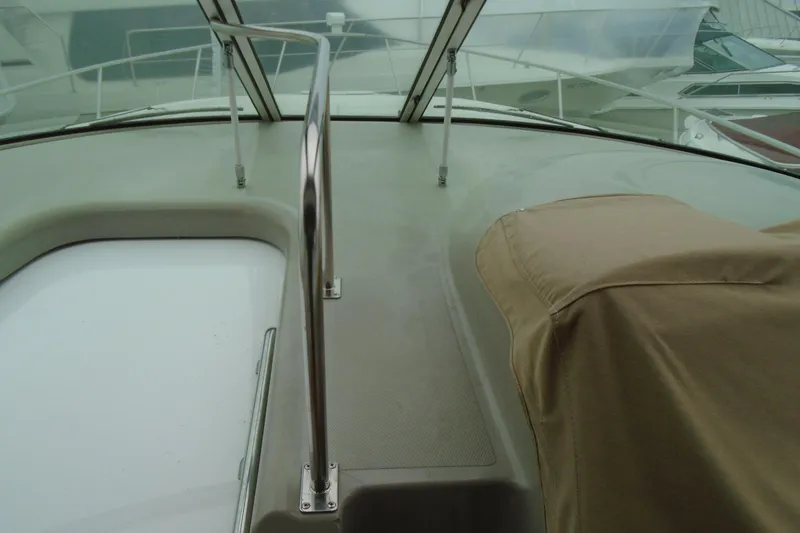 Slide: The Image of 2003 Cruisers Yachts 3470 Express deck with railing and covered equipment. - 20