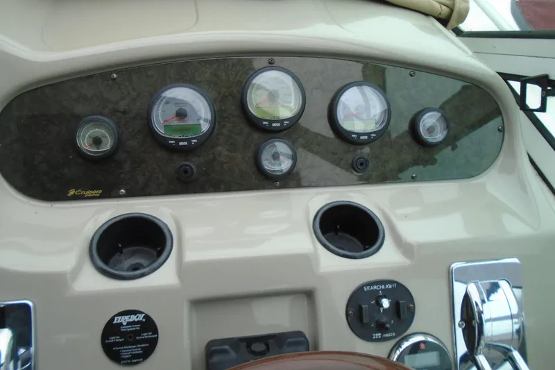 Slide: The Image of Dashboard of 2003 Cruisers Yachts 3470 Express with gauges and controls. - 24