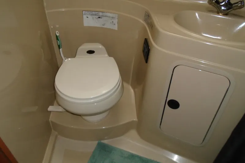 Slide: The Image of 2003 Cruisers Yachts 3470 Express bathroom with toilet and sink. - 39