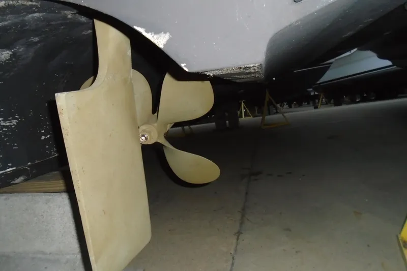 Slide: The Image of 2003 Cruisers Yachts 3470 Express propeller and rudder detail in dry dock. - 6