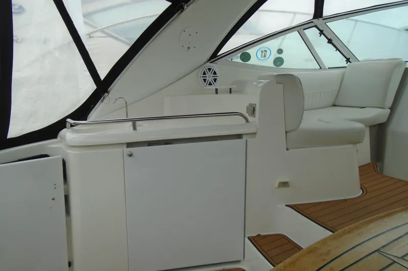 Slide: The Image of 2003 Cruisers Yachts 3470 Express interior with seating and cabinetry. - 14