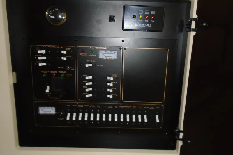 Slide: The Image of Electrical control panel on a 2003 Cruisers Yachts 3470 Express boat. - 33