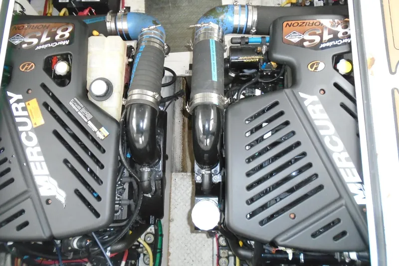 Slide: The Image of 2003 Cruisers Yachts 3470 Express engine compartment with dual Mercury 8.1S Horizon engines. - 43