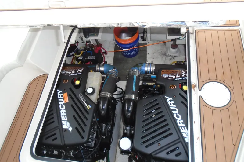 Slide: The Image of Engine compartment of 2003 Cruisers Yachts 3470 Express with twin Mercury engines. - 46