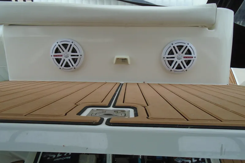 Slide: The Image of 2003 Cruisers Yachts 3470 Express swim platform with speakers and teak-style decking. - 48
