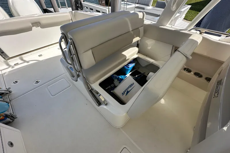 Slide: The Image of 2018 Boston Whaler 320 Vantage interior with storage compartment open. - 15