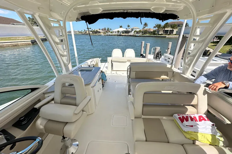 Slide: The Image of 2018 Boston Whaler 320 Vantage boat interior, featuring spacious seating and modern amenities. - 2