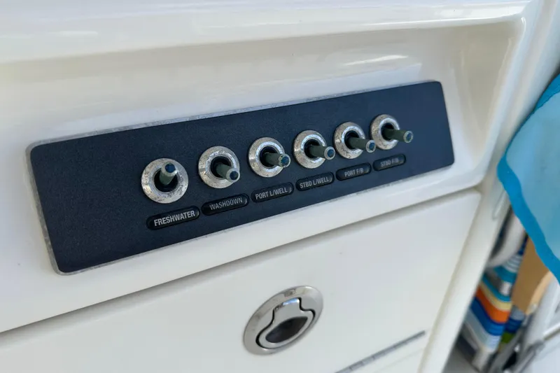 Slide: The Image of Control panel on a 2018 Boston Whaler 320 Vantage boat. - 6