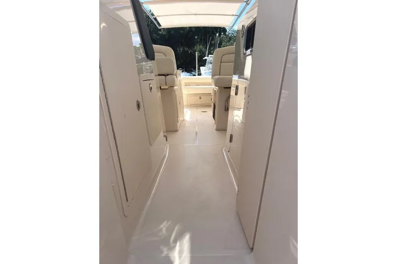 Slide: The Image of 2020 Grady-White Freedom 307 boat interior with seating and storage. - 21