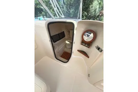 Slide: The Image of 2020 Grady-White Freedom 307 boat interior with cabin door and mirror. - 22