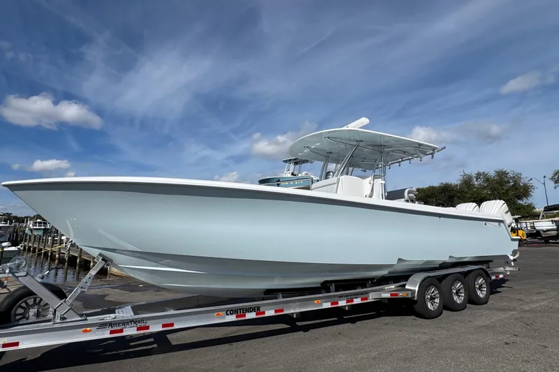 The Image of 2026 Contender 35 ST boat on trailer under blue sky. - 1