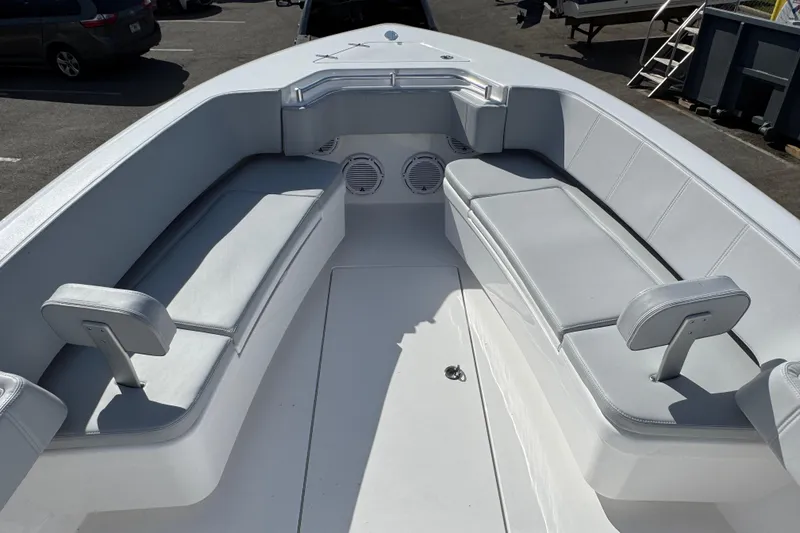 Slide: The Image of 2026 Contender 35 ST boat interior with cushioned seating and speakers. - 10