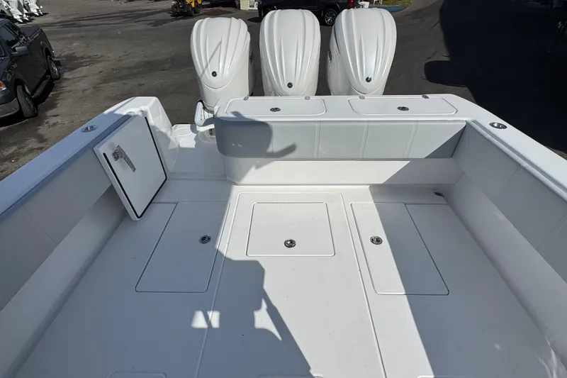 Slide: The Image of 2026 Contender 35 ST boat deck with triple outboard engines, spacious layout. - 13