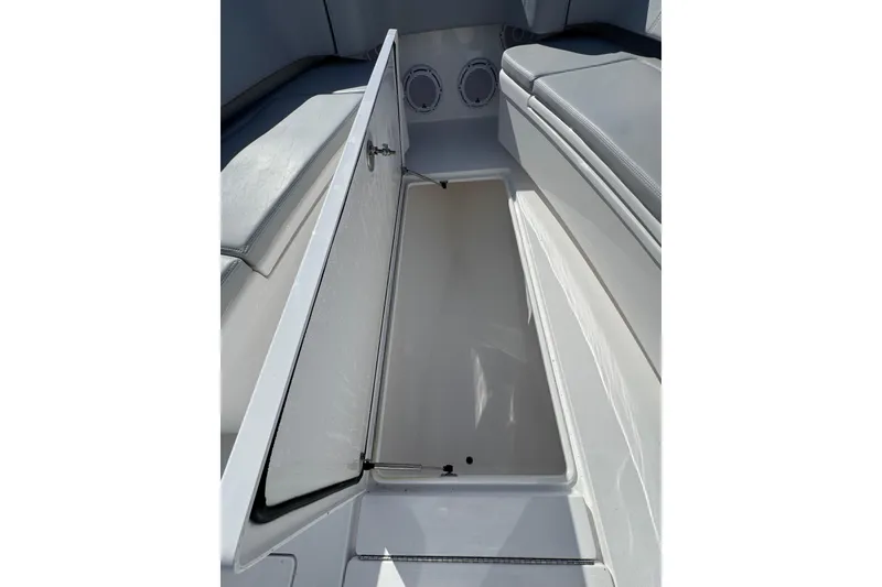 Slide: The Image of 2026 Contender 35 ST boat storage compartment with open hatch and cushioned seating. - 18