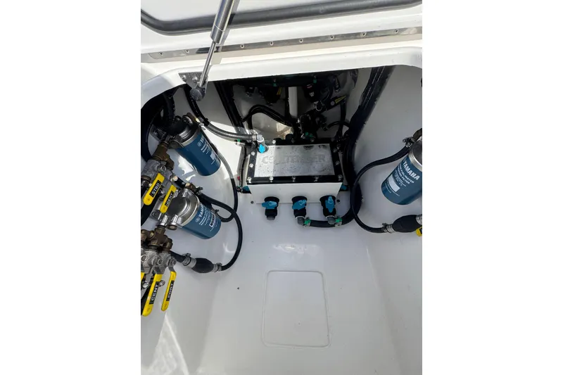 Slide: The Image of Contender 35 ST 2026 boat engine compartment with filters and hoses. - 19
