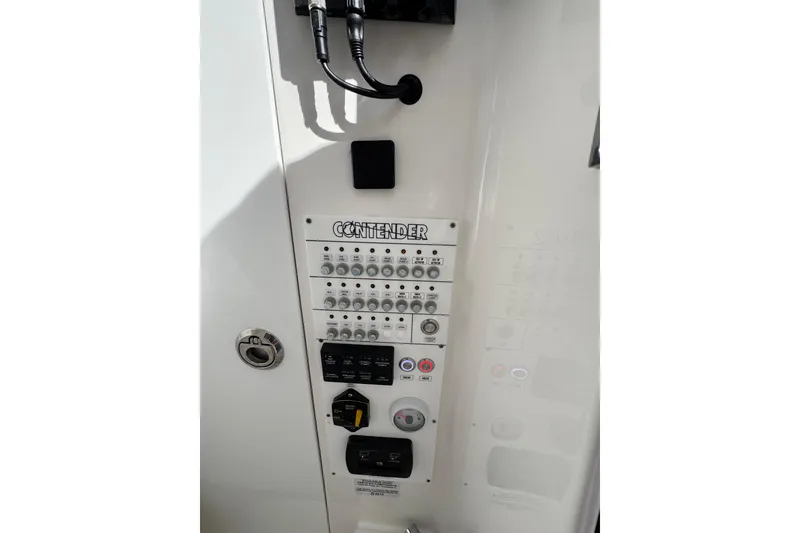 Slide: The Image of Control panel of 2026 Contender 35 ST boat with switches and dials. - 20