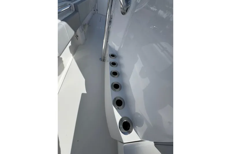 Slide: The Image of 2026 Contender 35 ST boat interior with rod holders and sleek design. - 22