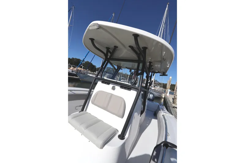 Slide: The Image of 2021 Cape Horn 31 T boat with T-top and seating, docked at marina. - 17