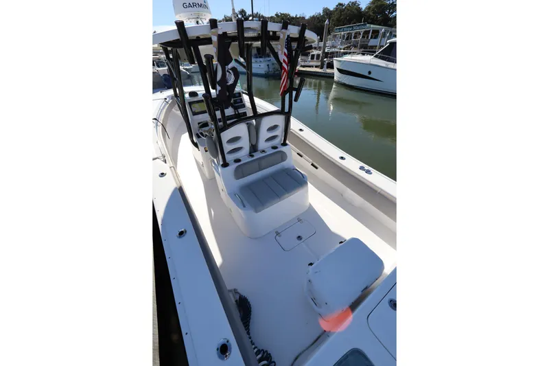 Slide: The Image of 2021 Cape Horn 31 T boat interior with seating and rod holders at marina. - 31