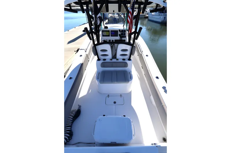 Slide: The Image of 2021 Cape Horn 31 T boat interior with helm and seating, docked at marina. - 35