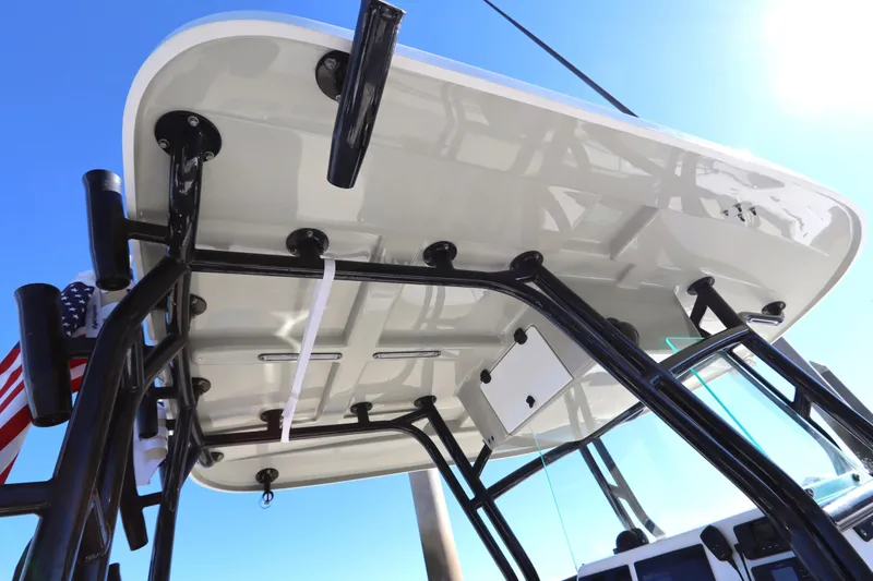 Slide: The Image of 2021 Cape Horn 31 T boat's T-top structure against clear blue sky. - 38