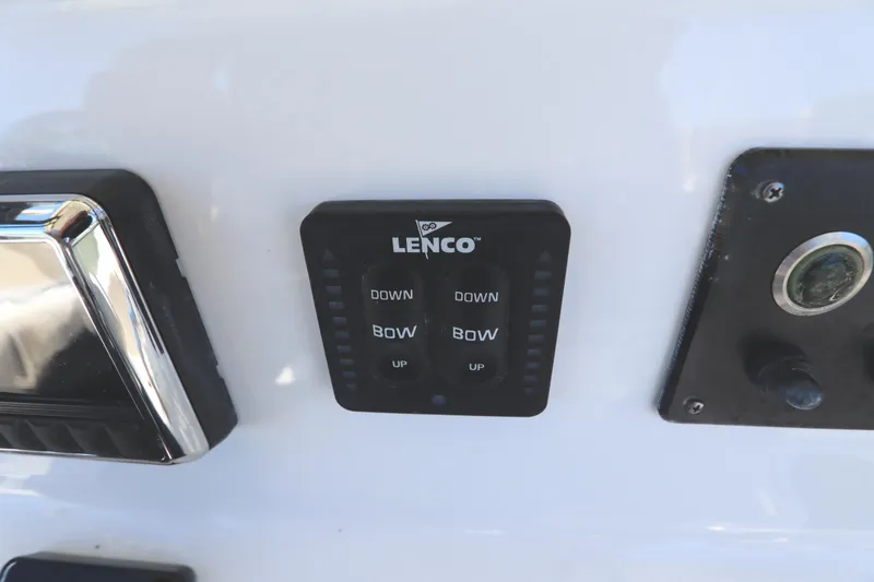 Slide: The Image of Lenco trim tab control panel on 2021 Cape Horn 31 T boat dashboard. - 41
