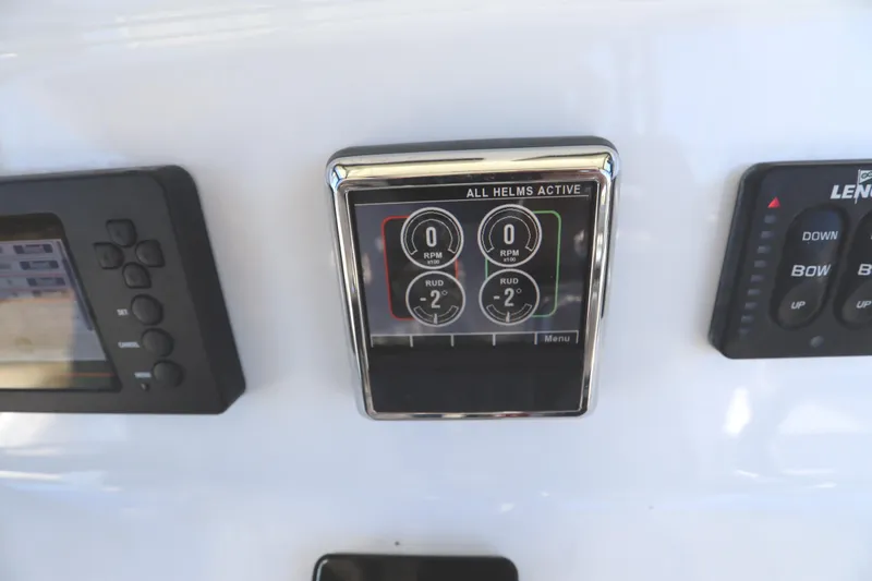 Slide: The Image of 2021 Cape Horn 31 T helm controls with digital display and buttons. - 45