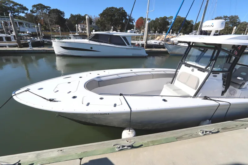 Slide: The Image of 2021 Cape Horn 31 T boat docked at a marina, featuring sleek design and spacious deck. - 8