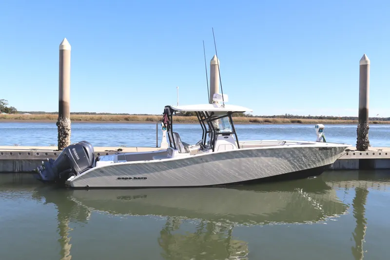 The Image of 2021 Cape Horn 31 T boat docked on calm water under clear blue sky. - 1