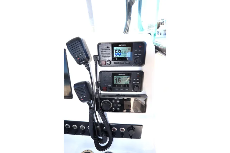 Slide: The Image of 2021 Cape Horn 31 T boat console with Garmin and Fusion marine electronics. - 26