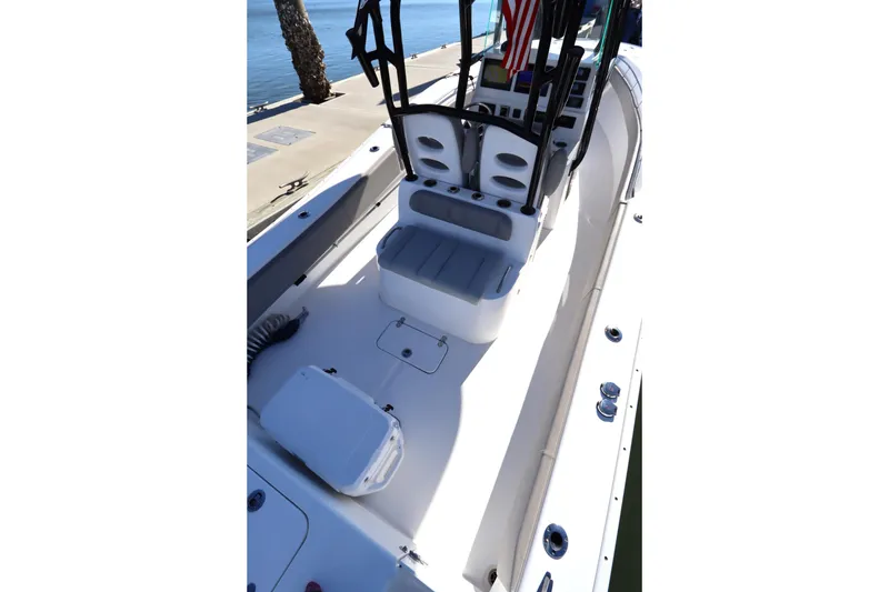 Slide: The Image of 2021 Cape Horn 31 T boat interior with seating and console, docked by the water. - 29