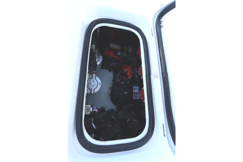 Slide: The Image of 2021 Cape Horn 31 T boat storage compartment with visible equipment and wiring. - 37