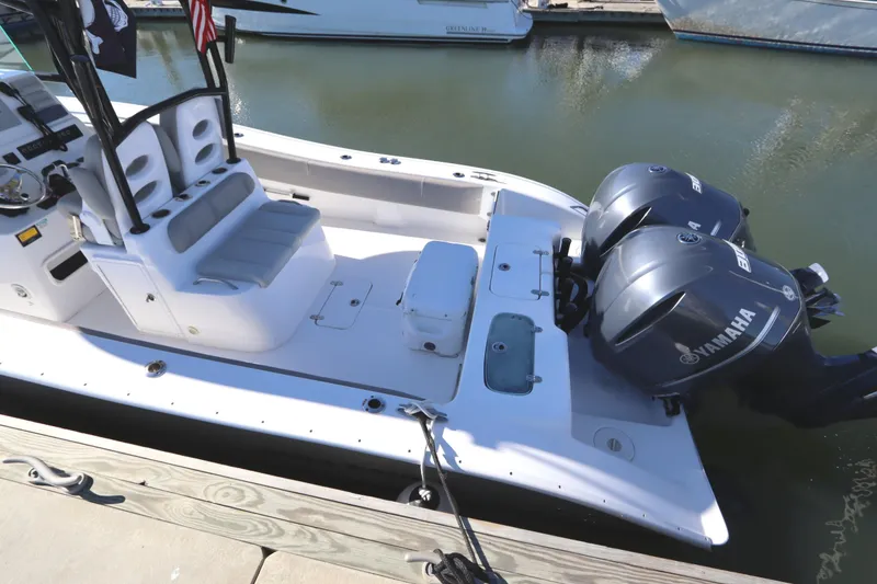 Slide: The Image of 2021 Cape Horn 31 T boat with dual Yamaha engines docked at marina. - 7