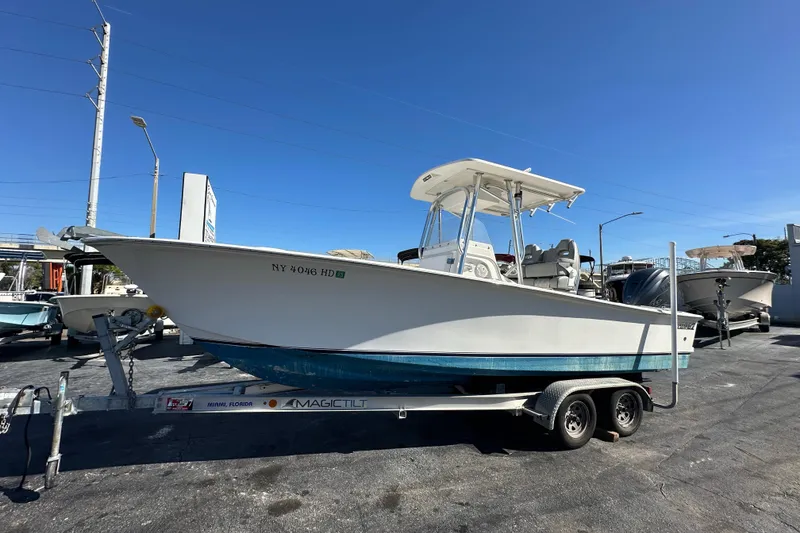The Image of 2005 Topaz 24 Silverhawk boat on trailer under clear blue sky. - 0