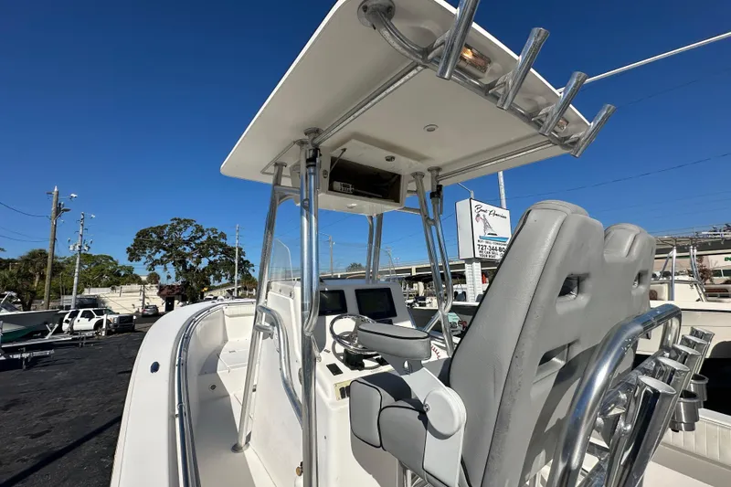 Slide: The Image of 2005 Topaz 24 Silverhawk boat cockpit with dual seats and navigation equipment. - 14