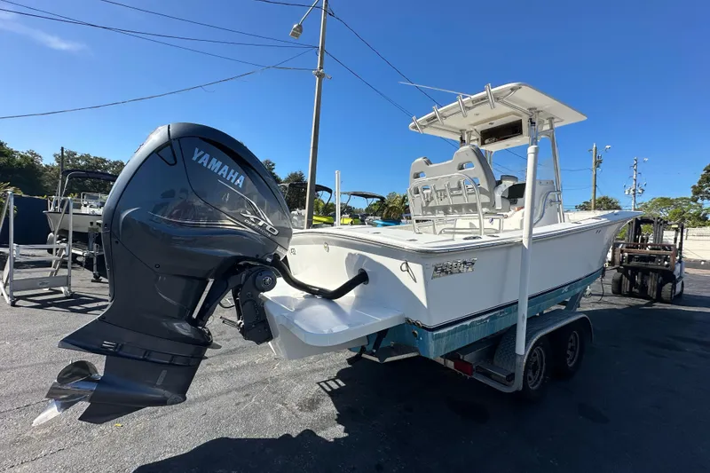Slide: The Image of 2005 Topaz 24 Silverhawk boat with Yamaha outboard motor on trailer. - 3