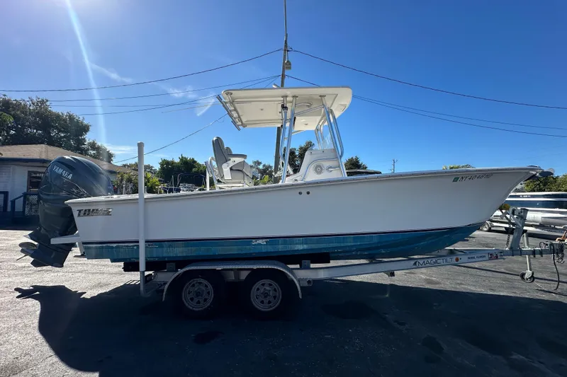 Slide: The Image of 2005 Topaz 24 Silverhawk boat on trailer, featuring Yamaha outboard motor. - 4