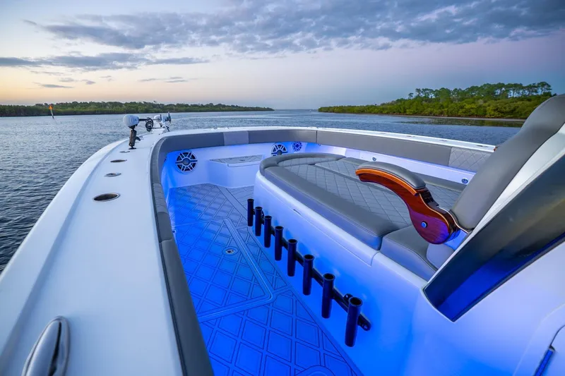 Slide: The Image of Luxurious 2025 Freeman 43 boat interior with blue LED lighting at sunset. - 10