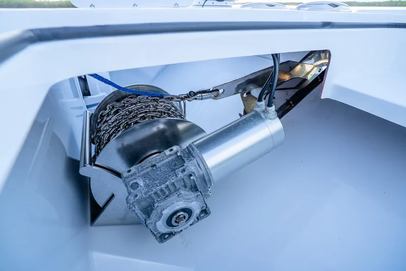 Slide: The Image of Anchor winch system on a 2025 Freeman 43 boat, showcasing chain and motor components. - 13