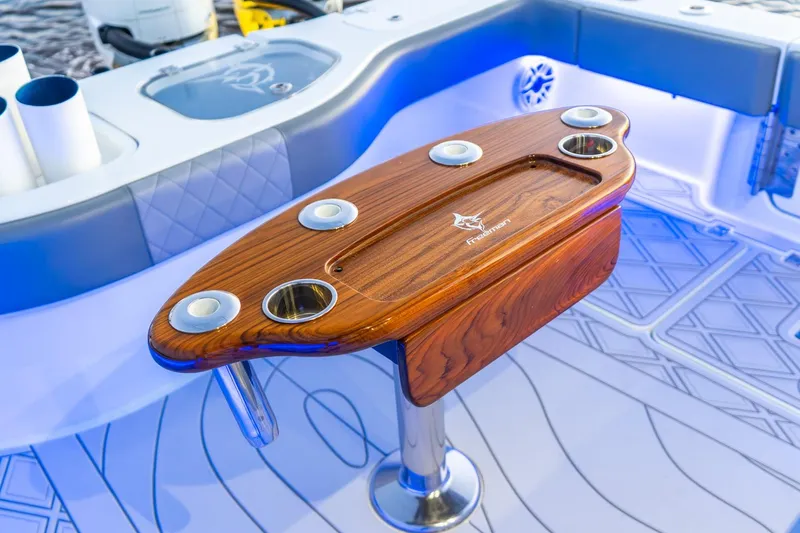 Slide: The Image of Luxurious Freeman 43 boat interior with elegant wooden table, 2025 model. - 21
