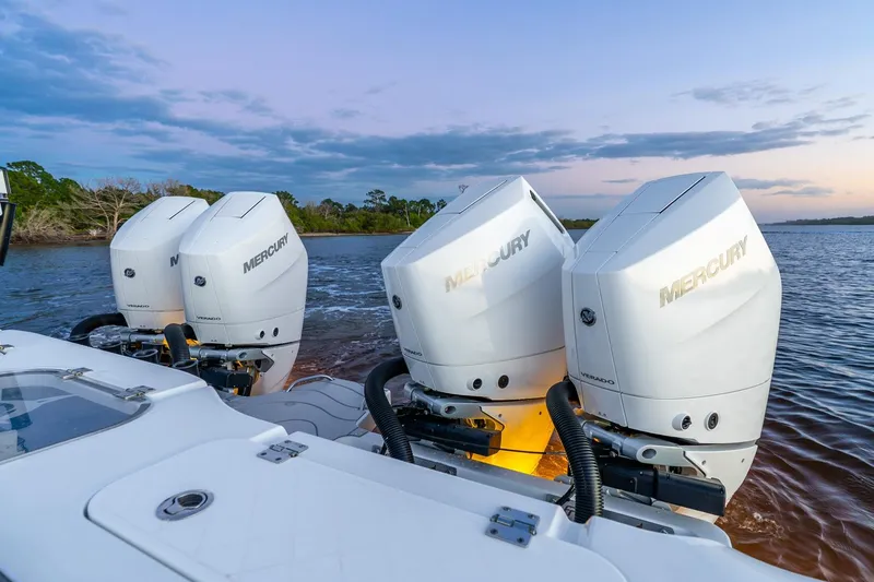 Slide: The Image of 2025 Freeman 43 boat with four Mercury Verado outboard engines on a calm water backdrop. - 22