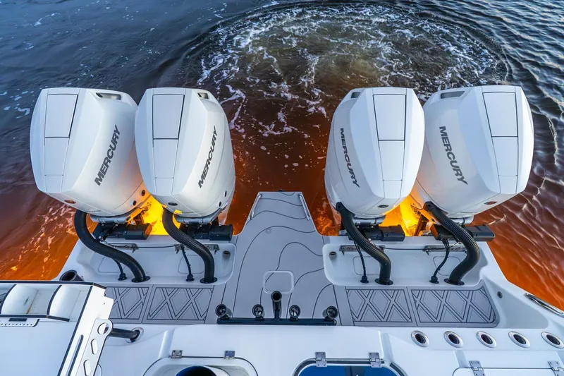 Slide: The Image of Freeman 43 boat with four Mercury outboard engines, 2025 model, on water. - 23